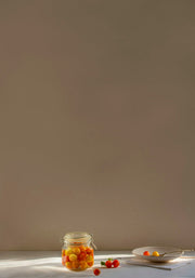 a jar of jelly beans sitting on a table